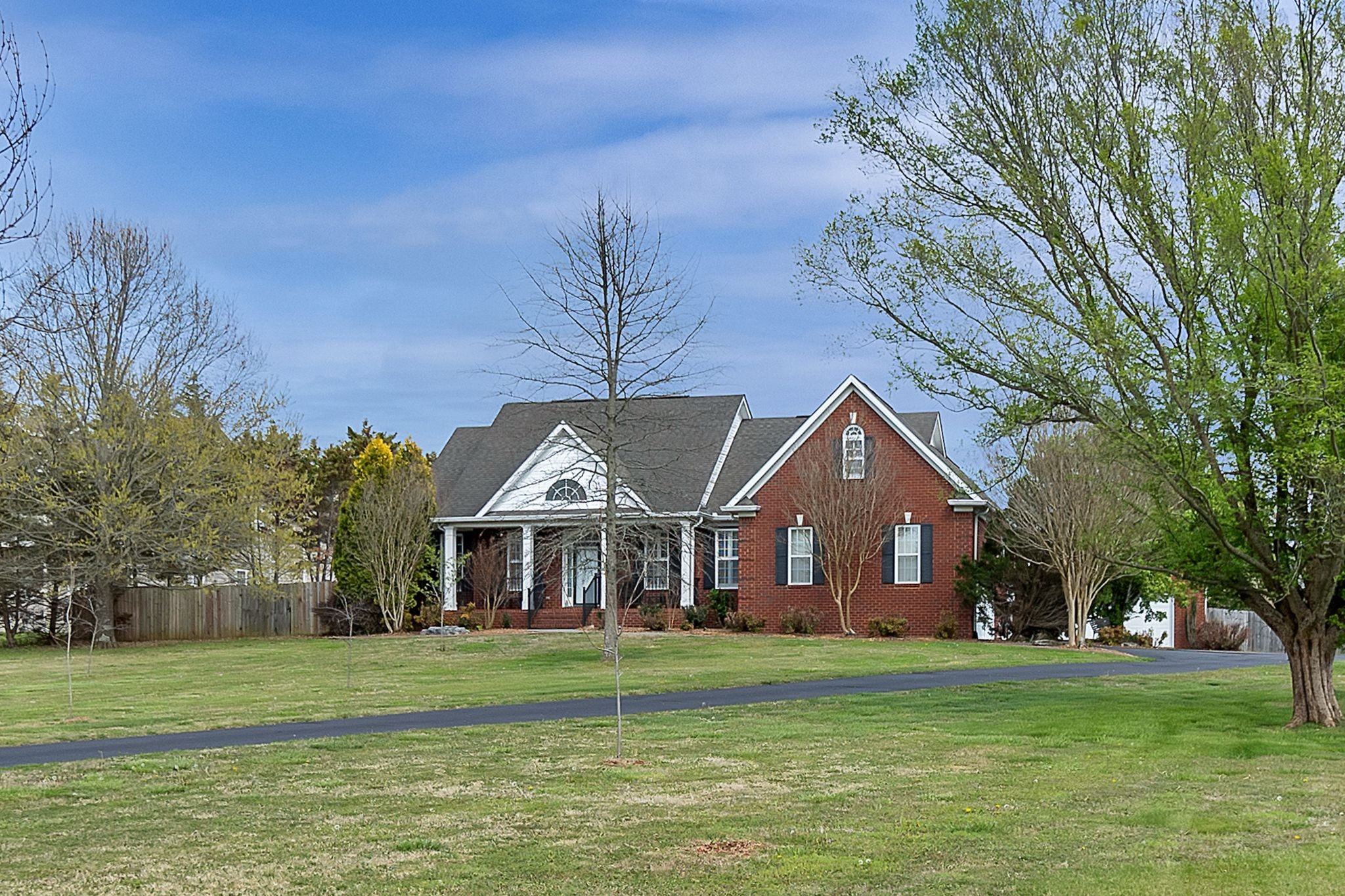 2166 Toby Robertson Road Spring Hill, TN 37174 - Photo 7 of 46 a front view of a house with a garden
