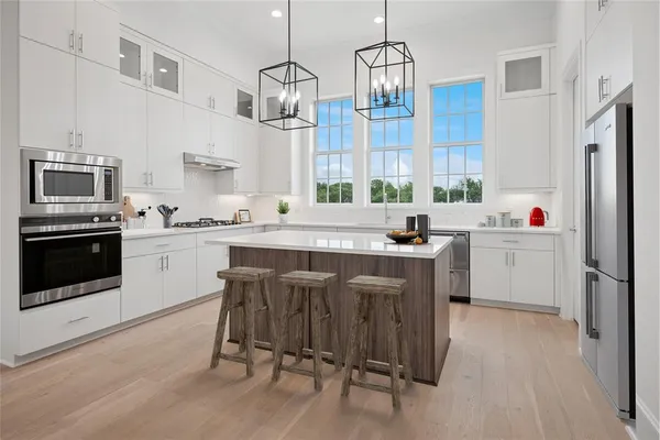 a kitchen with a sink cabinets and window