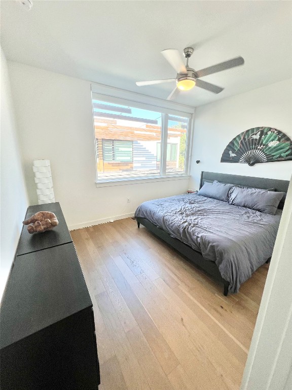 2002 East 7th Street, Unit 223 Austin, TX 78702 - Photo 7 of 14 a bedroom with a bed and window