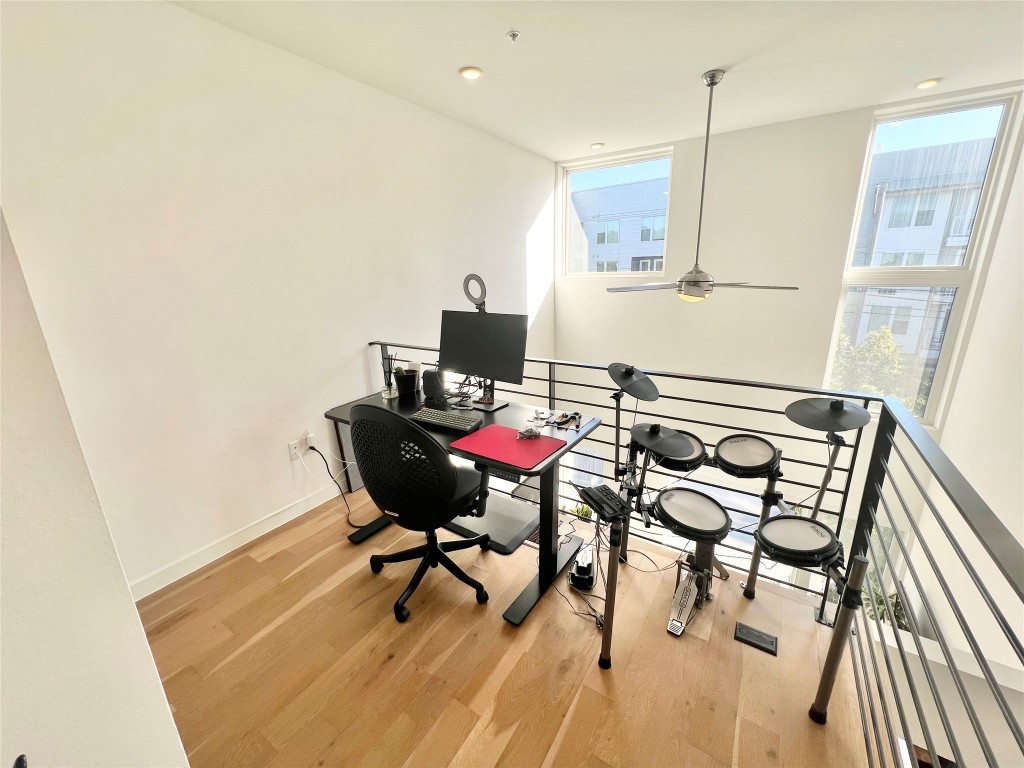 2002 East 7th Street, Unit 223 Austin, TX 78702 - Photo 8 of 14 a living room with furniture and wooden floor