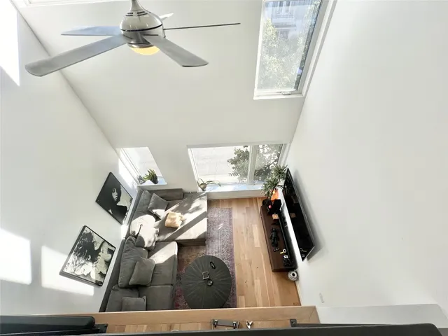 a view of living room with furniture and a window