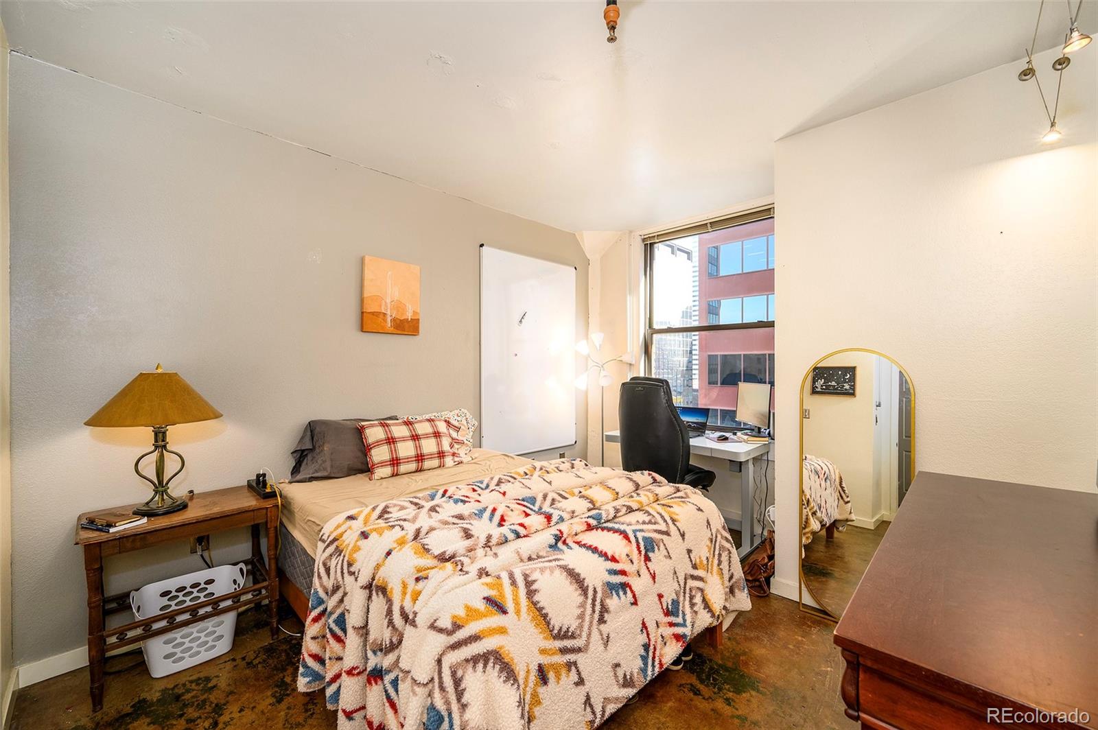 444 17th Street, Unit 904 Denver, CO 80202 - Photo 11 of 18 a bedroom with bed and a window