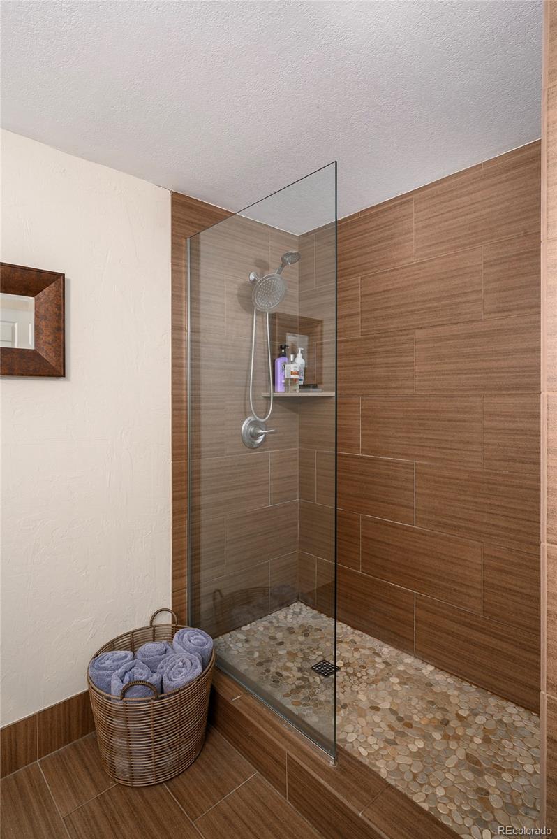 444 17th Street, Unit 904 Denver, CO 80202 - Photo 14 of 18 a bathroom with a granite countertop sink a toilet