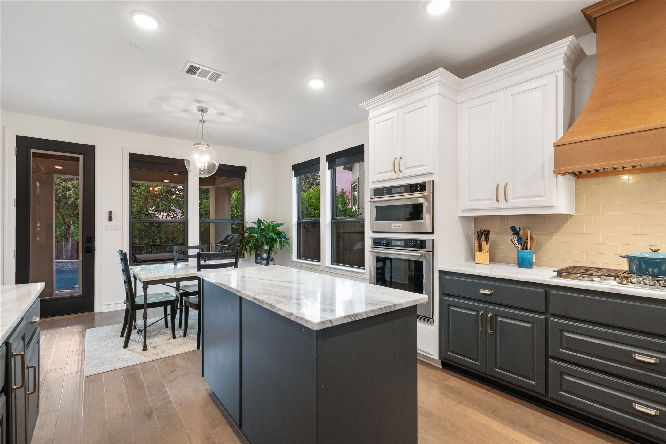 2829 Long Lasso Pass Leander, TX 78641 - Photo 13 of 40 a large kitchen with kitchen island a large island in it