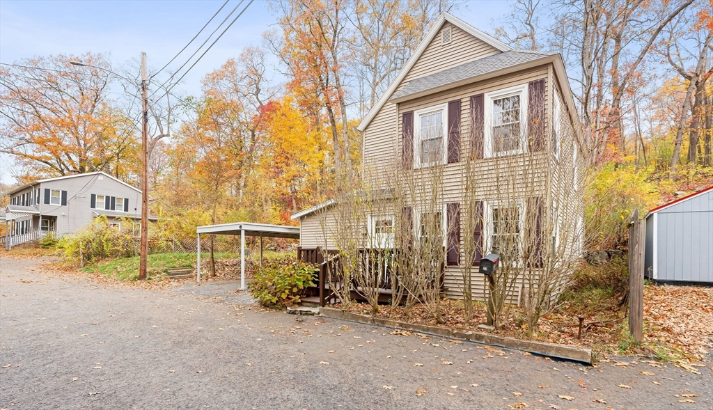 23 Fletcher Place Athol, MA 01331 - Photo 28 of 29 a view of a house with a large tree and wooden fence
