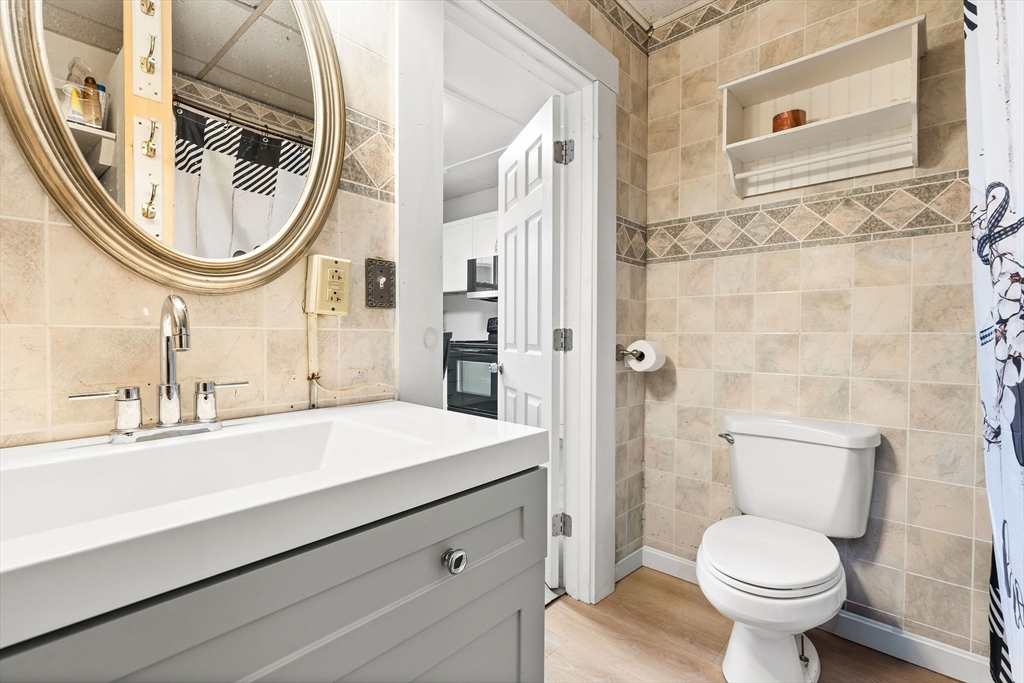 23 Fletcher Place Athol, MA 01331 - Photo 9 of 29 a bathroom with a sink a toilet and a mirror