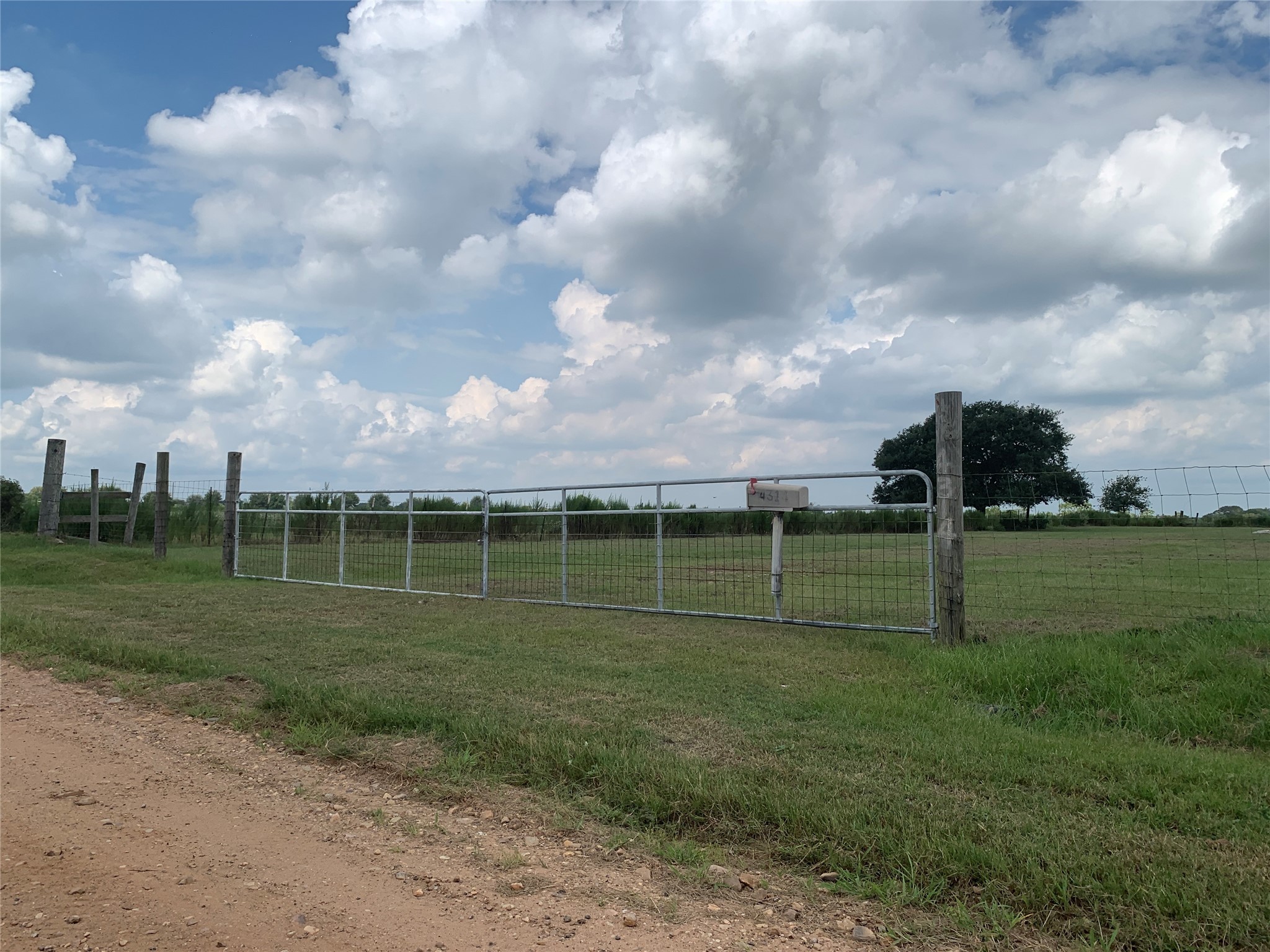 4314 Orange Hill Road Sealy, TX 77474 - Photo 13 of 13 a view of a golf course with a big yard