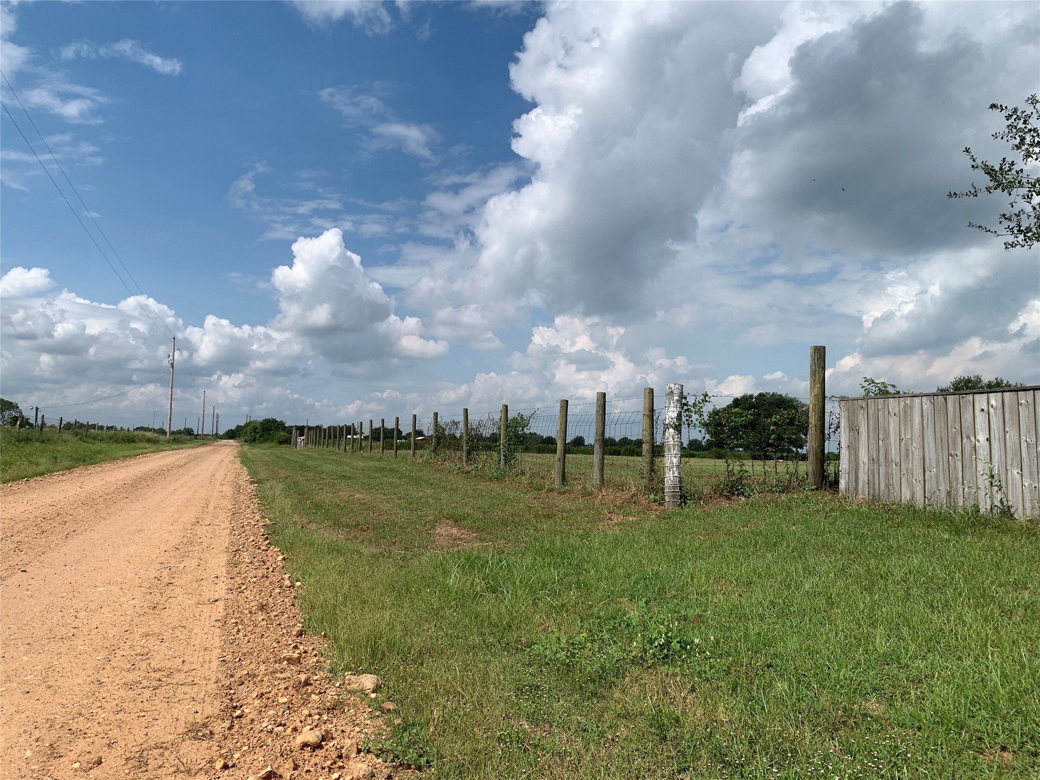 4314 Orange Hill Road Sealy, TX 77474 - Photo 2 of 13 a view of a lake with a big yard