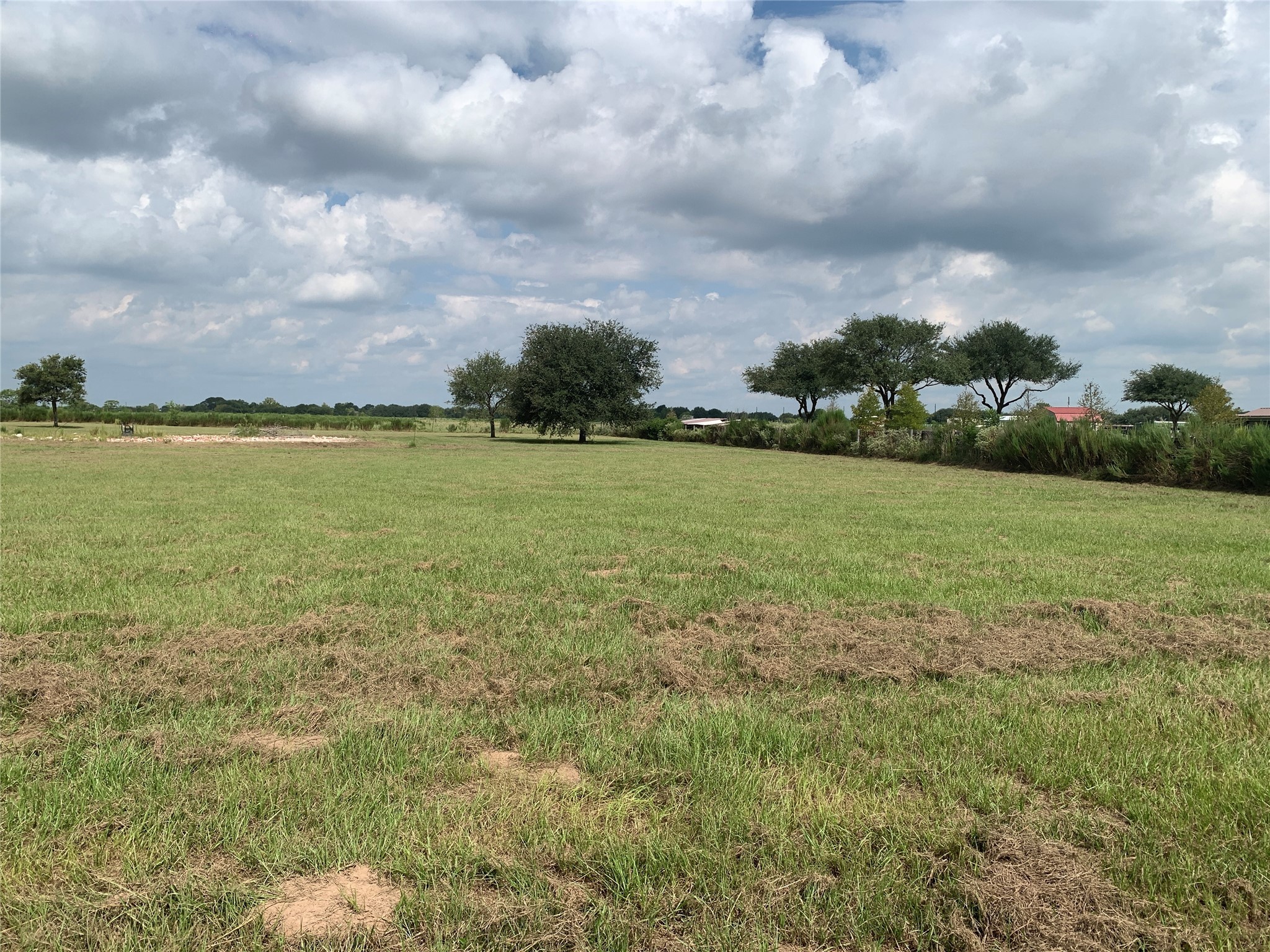 4314 Orange Hill Road Sealy, TX 77474 - Photo 9 of 13 a view of a field with an ocean