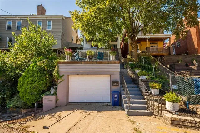 a front view of a house with a garage