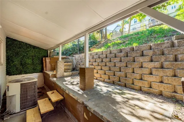 a view of a chairs and table in patio