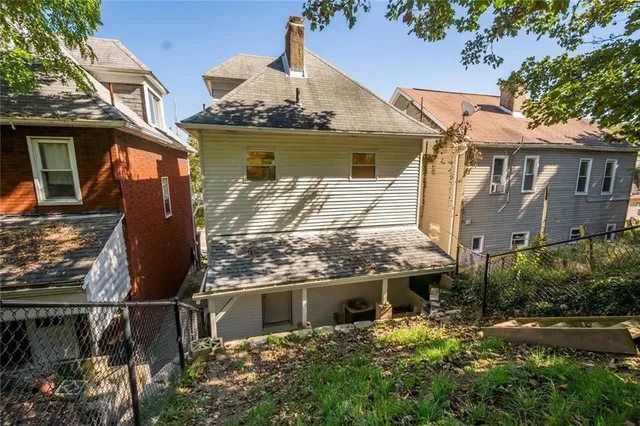 a aerial view of a house with a yard