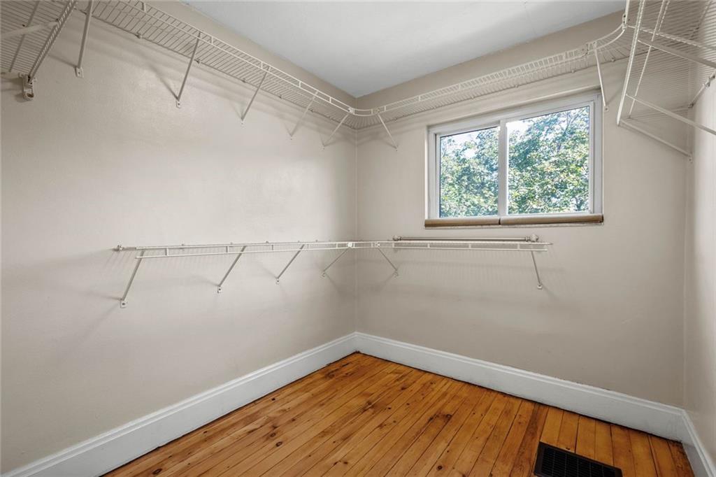 324 Merrimac Street Pittsburgh, PA 15211 - Photo 28 of 37 a view of a room with wooden floor and small window