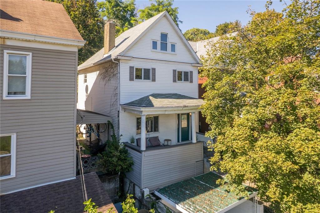 324 Merrimac Street Pittsburgh, PA 15211 - Photo 31 of 37 a view of a white house next to a yard