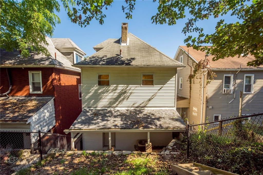 324 Merrimac Street Pittsburgh, PA 15211 - Photo 32 of 37 a front view of a house with parking
