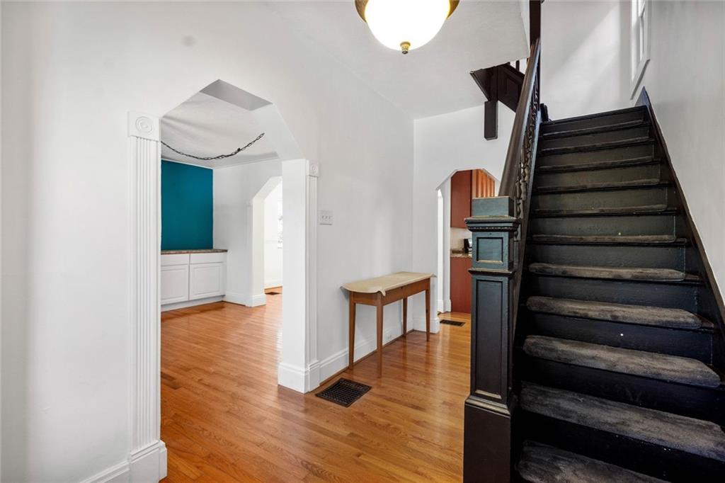 324 Merrimac Street Pittsburgh, PA 15211 - Photo 6 of 37 a view of entryway and hall with wooden floor