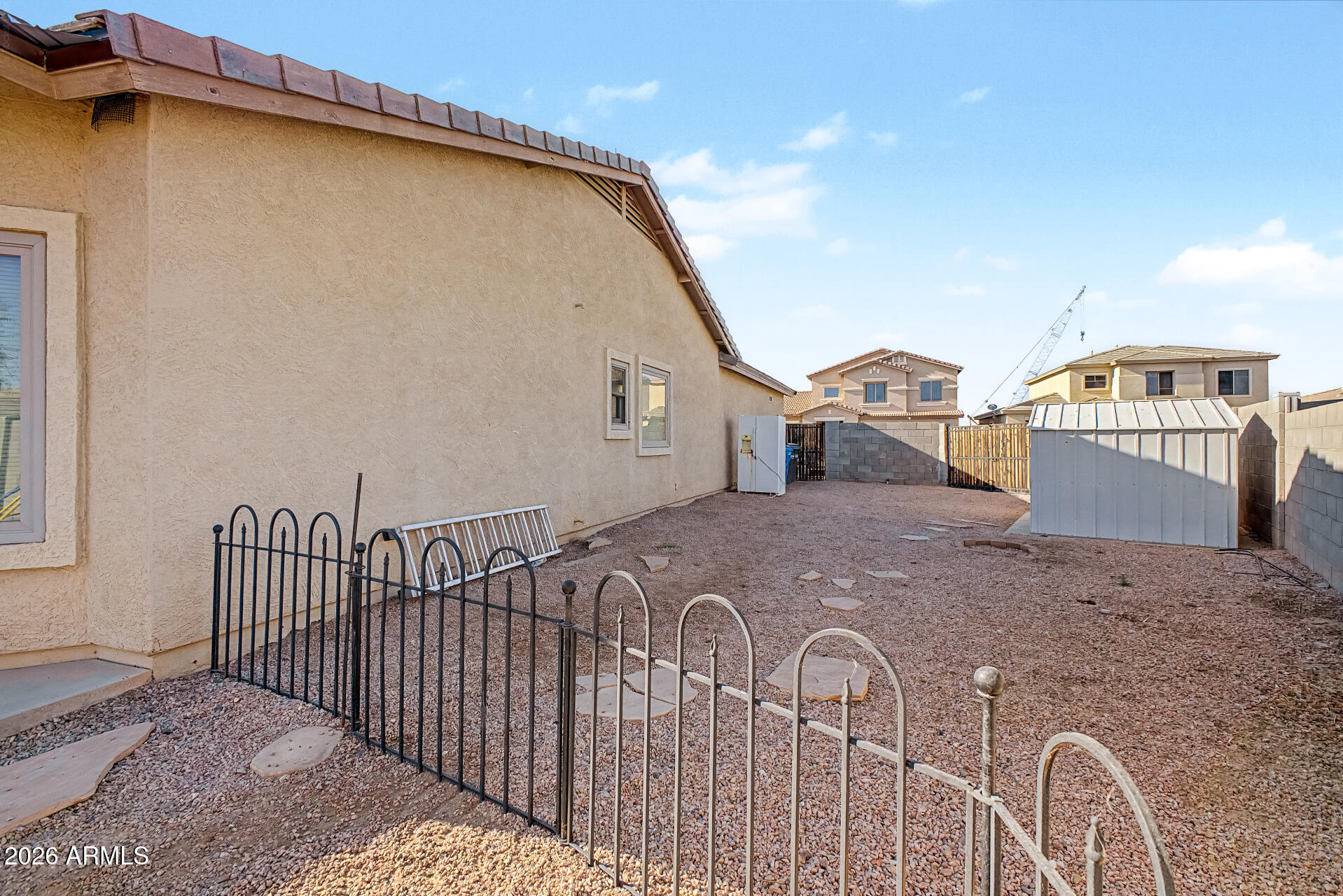 5301 West Grenadine Road Laveen, AZ 85339 - Photo 3 of 37 a view of a house with a backyard