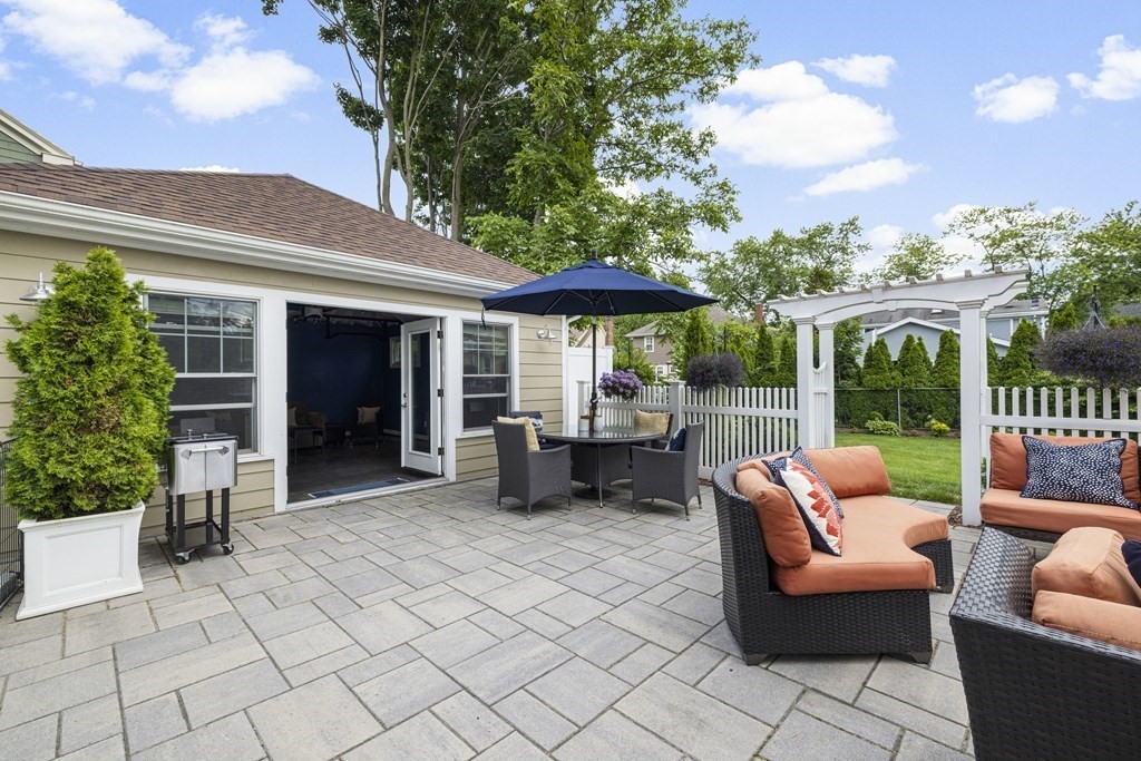 1 Auburndale Road Marblehead, MA 01945 - Photo 24 of 29 a view of a patio with couches table and chairs and potted plants