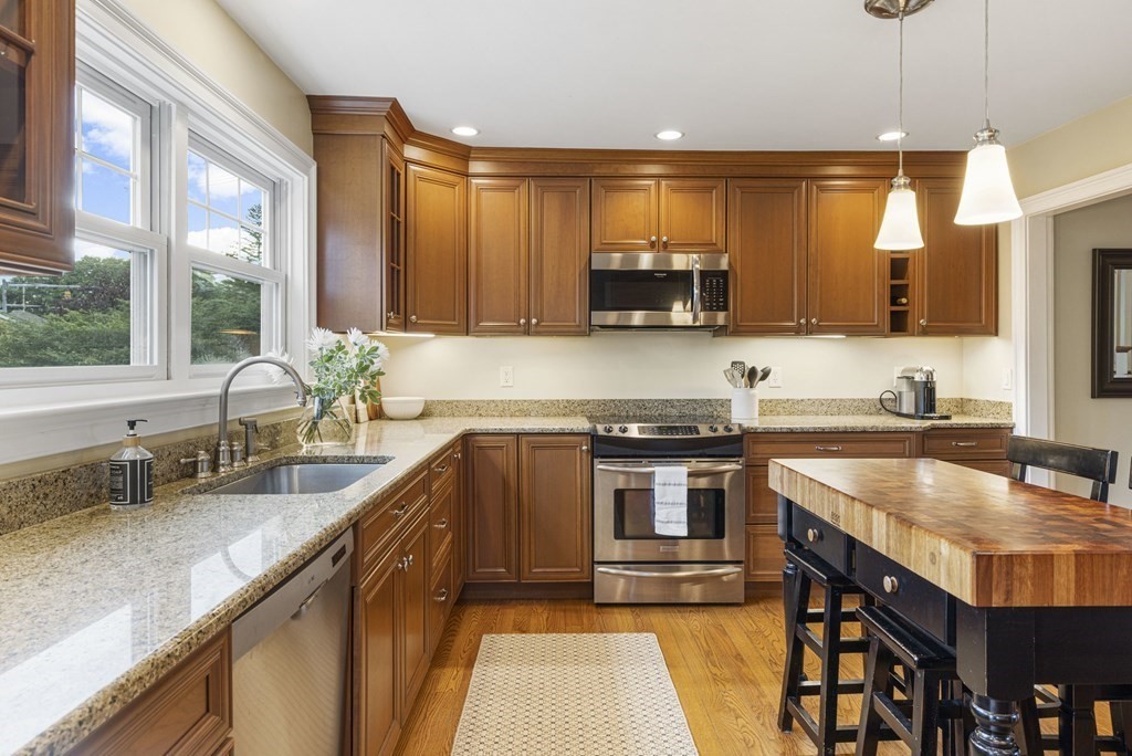 1 Auburndale Road Marblehead, MA 01945 - Photo 8 of 29 a kitchen with stainless steel appliances granite countertop a sink stove and microwave