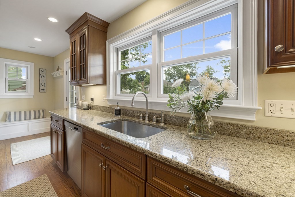 1 Auburndale Road Marblehead, MA 01945 - Photo 9 of 29 a kitchen with granite countertop a sink and a window