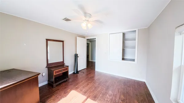 a view of kitchen with sink and wooden floor