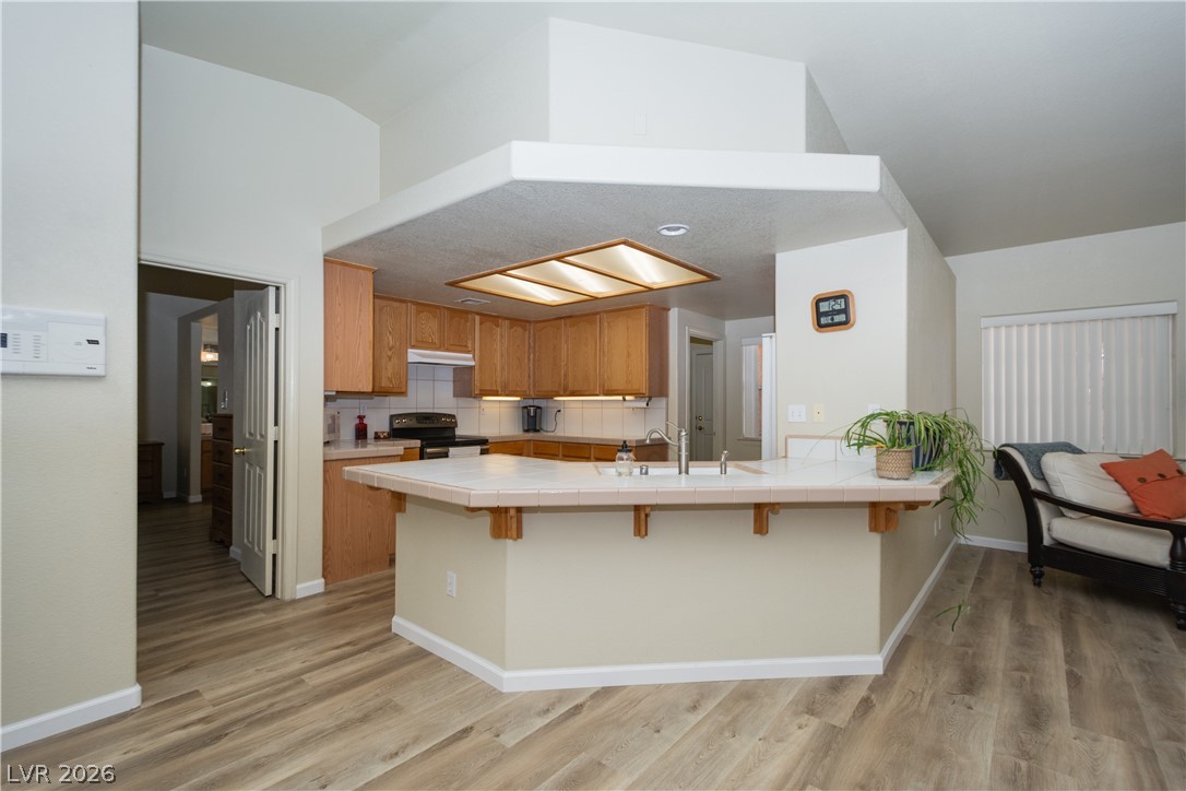 2381 Tough Boy Road Pahrump, NV 89060 - Photo 8 of 44 This spacious kitchen offers a large island with ample counter space and storage.