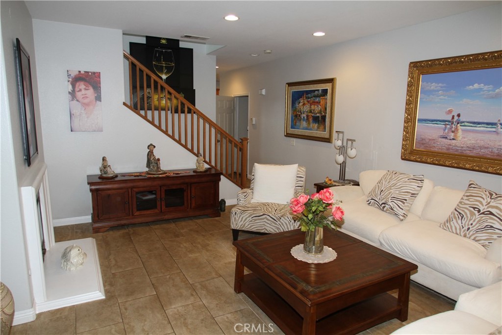2660 West Madison Circle Anaheim, CA 92801 - Photo 12 of 52 a living room with furniture and a table