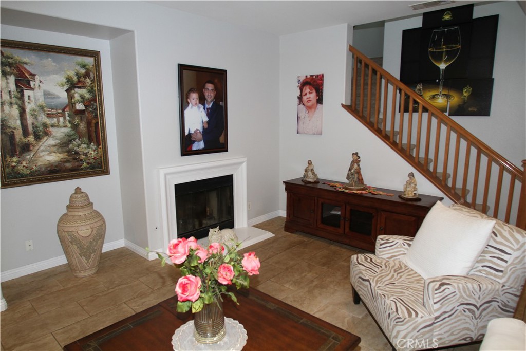 2660 West Madison Circle Anaheim, CA 92801 - Photo 13 of 52 a living room with furniture and a fireplace