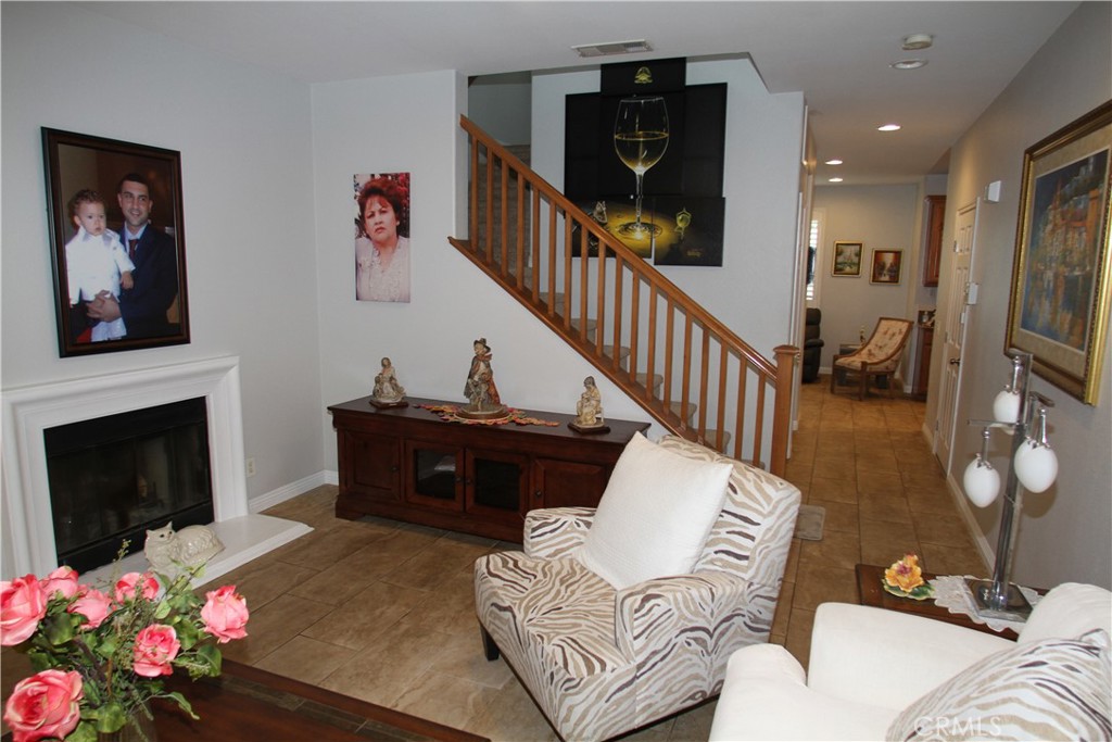 2660 West Madison Circle Anaheim, CA 92801 - Photo 14 of 52 a living room with furniture and a fireplace