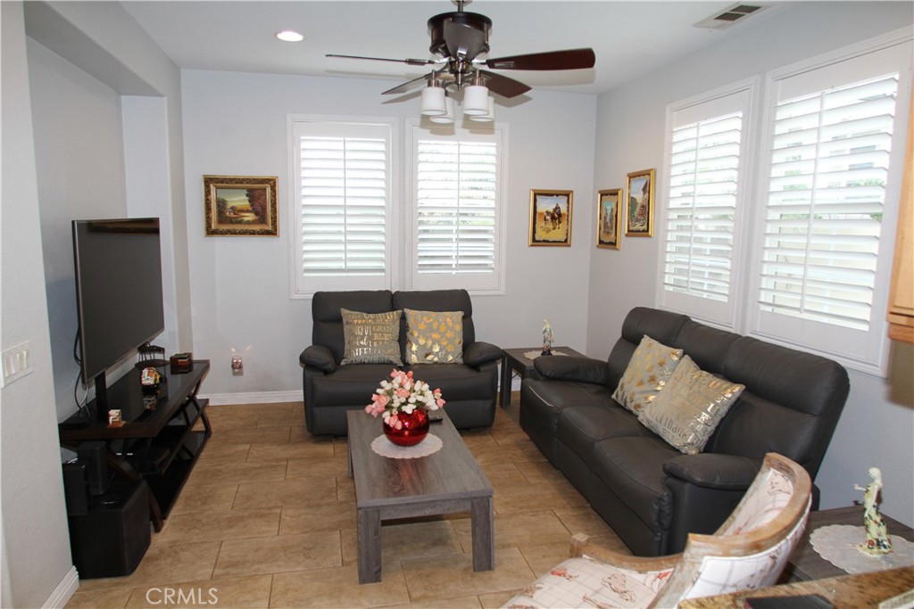 2660 West Madison Circle Anaheim, CA 92801 - Photo 15 of 52 a living room with furniture and a flat screen tv
