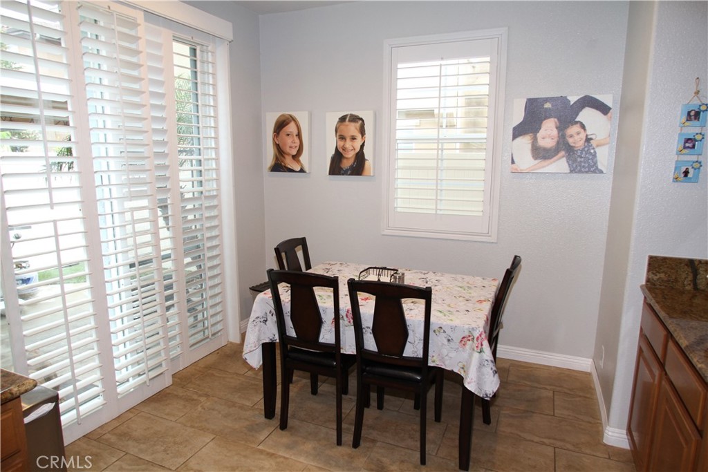2660 West Madison Circle Anaheim, CA 92801 - Photo 18 of 52 a view of a dining room with furniture and a window