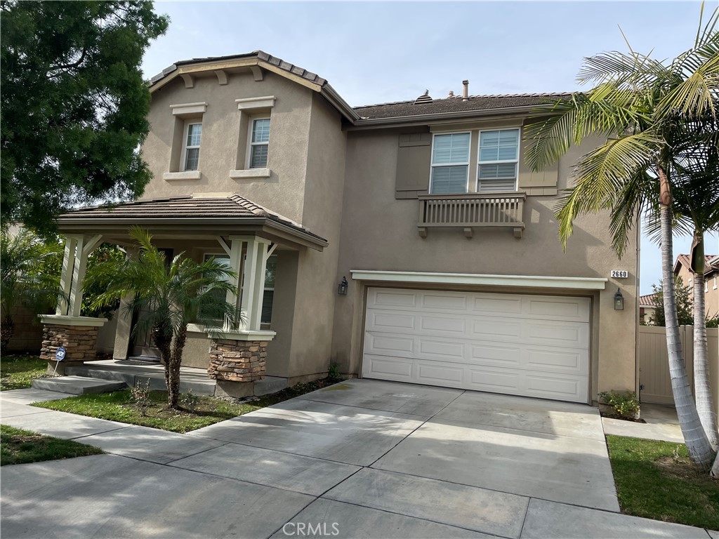 2660 West Madison Circle Anaheim, CA 92801 - Photo 2 of 52 a front view of a house with garden