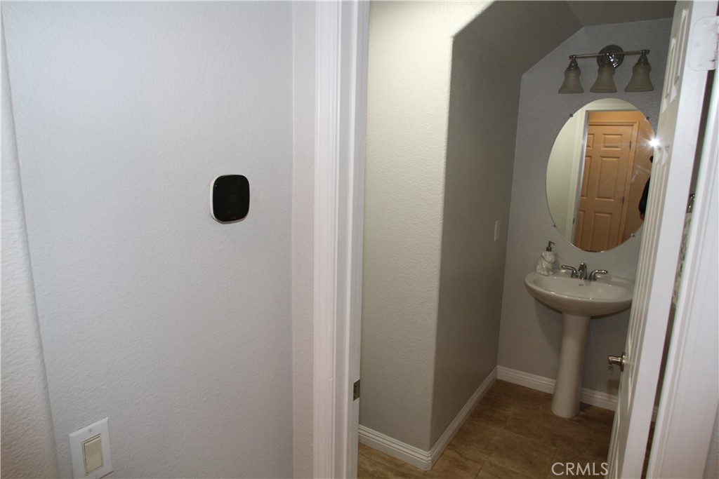 2660 West Madison Circle Anaheim, CA 92801 - Photo 22 of 52 a view of bathroom with a sink and mirror