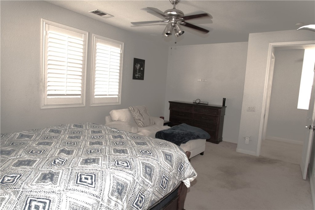 2660 West Madison Circle Anaheim, CA 92801 - Photo 26 of 52 a bedroom with a bed and wooden floor