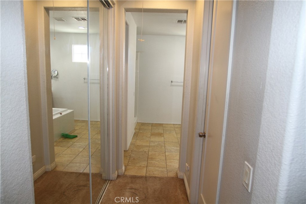 2660 West Madison Circle Anaheim, CA 92801 - Photo 28 of 52 a bathroom that has a glass shower door