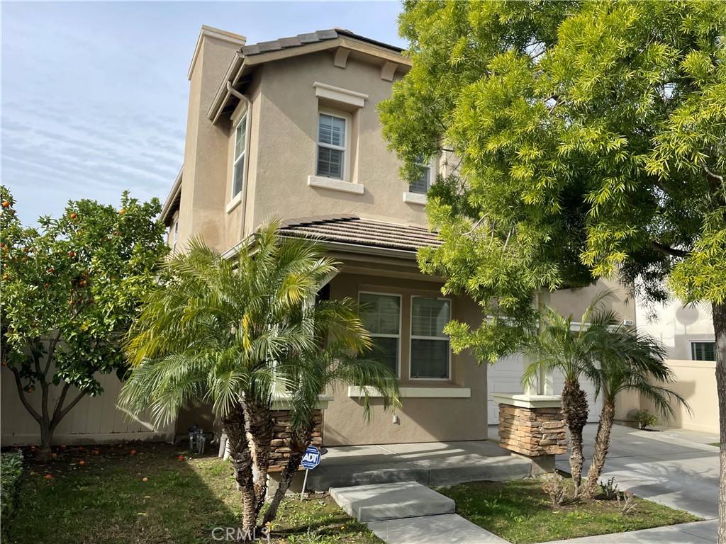 2660 West Madison Circle Anaheim, CA 92801 - Photo 3 of 52 a front view of a house with a yard