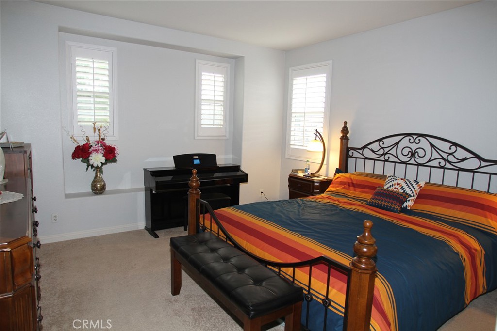 2660 West Madison Circle Anaheim, CA 92801 - Photo 33 of 52 a bedroom with furniture and a window