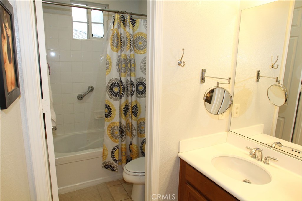 2660 West Madison Circle Anaheim, CA 92801 - Photo 36 of 52 a bathroom with a sink toilet and shower
