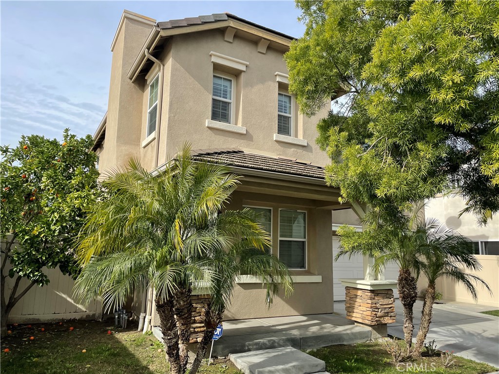 2660 West Madison Circle Anaheim, CA 92801 - Photo 4 of 52 a front view of a house with garden
