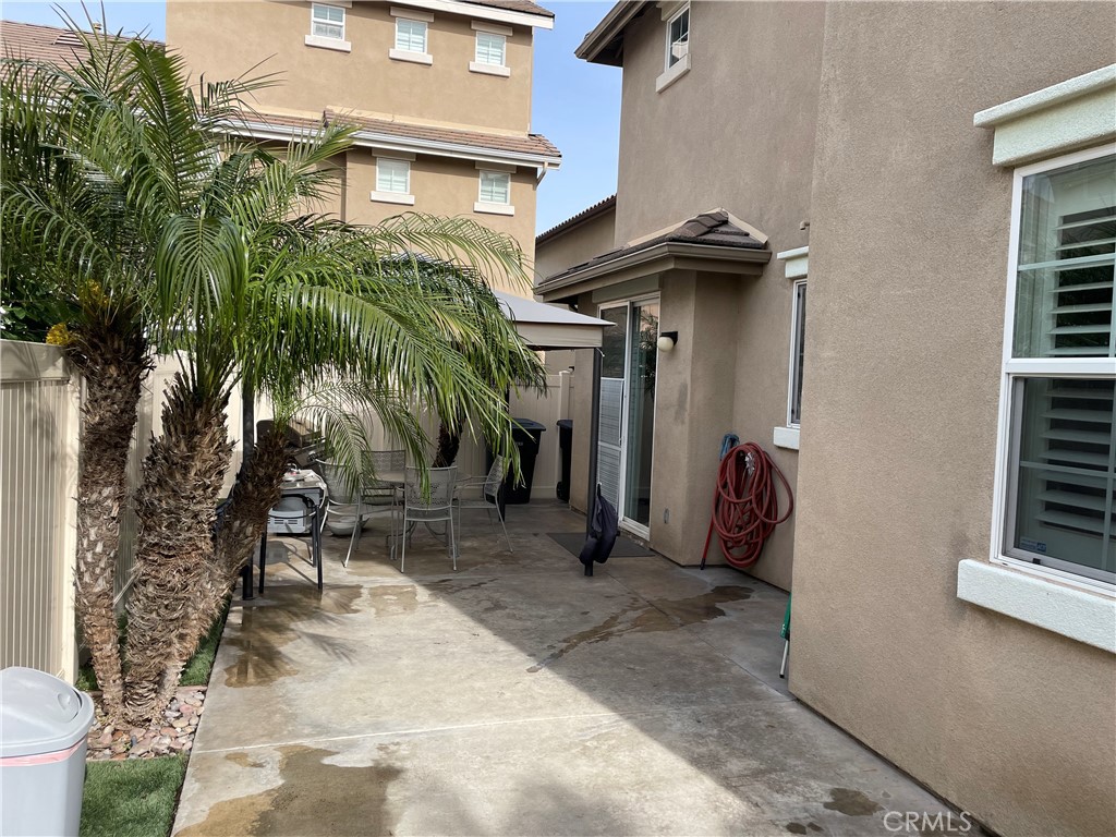 2660 West Madison Circle Anaheim, CA 92801 - Photo 8 of 52 a view of a house with a yard and potted plants