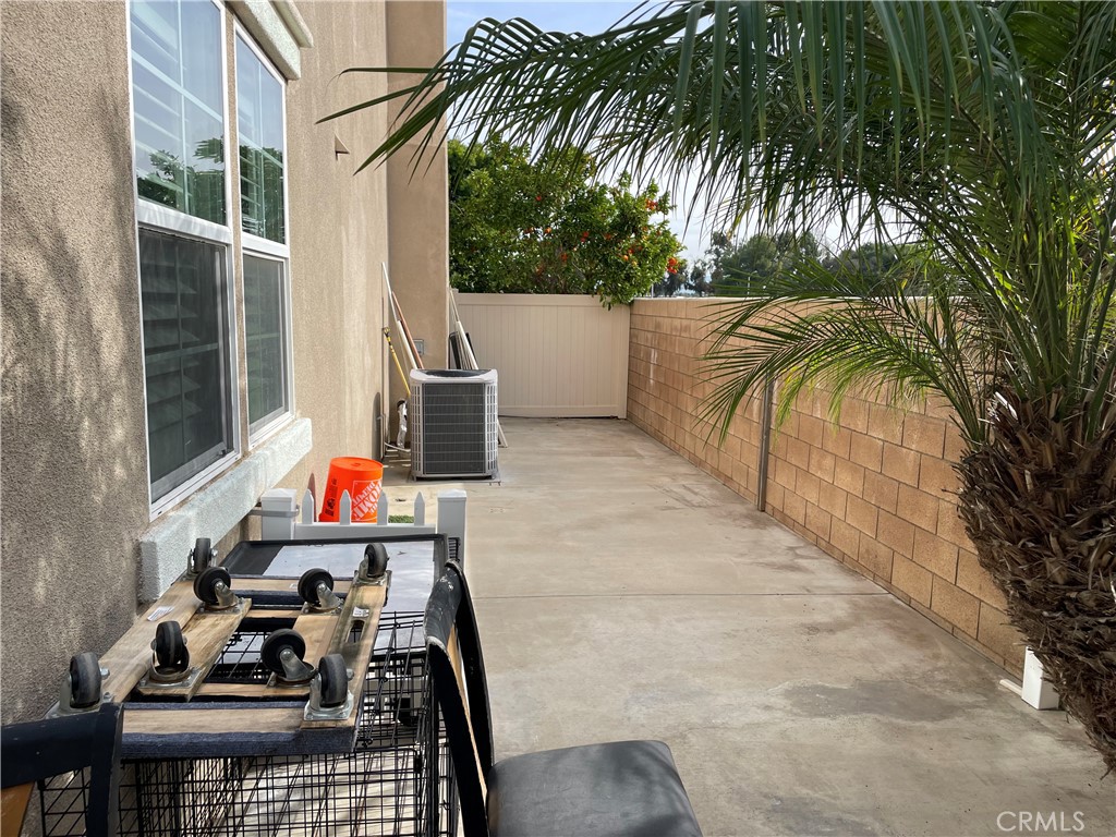 2660 West Madison Circle Anaheim, CA 92801 - Photo 10 of 52 a view of balcony with potted plants and palm trees