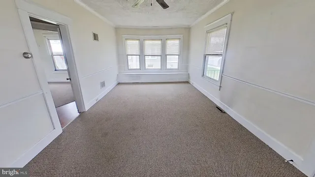 an empty room with windows