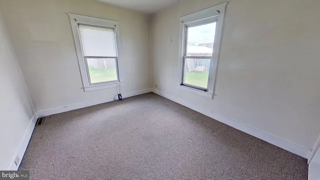 an empty room with windows