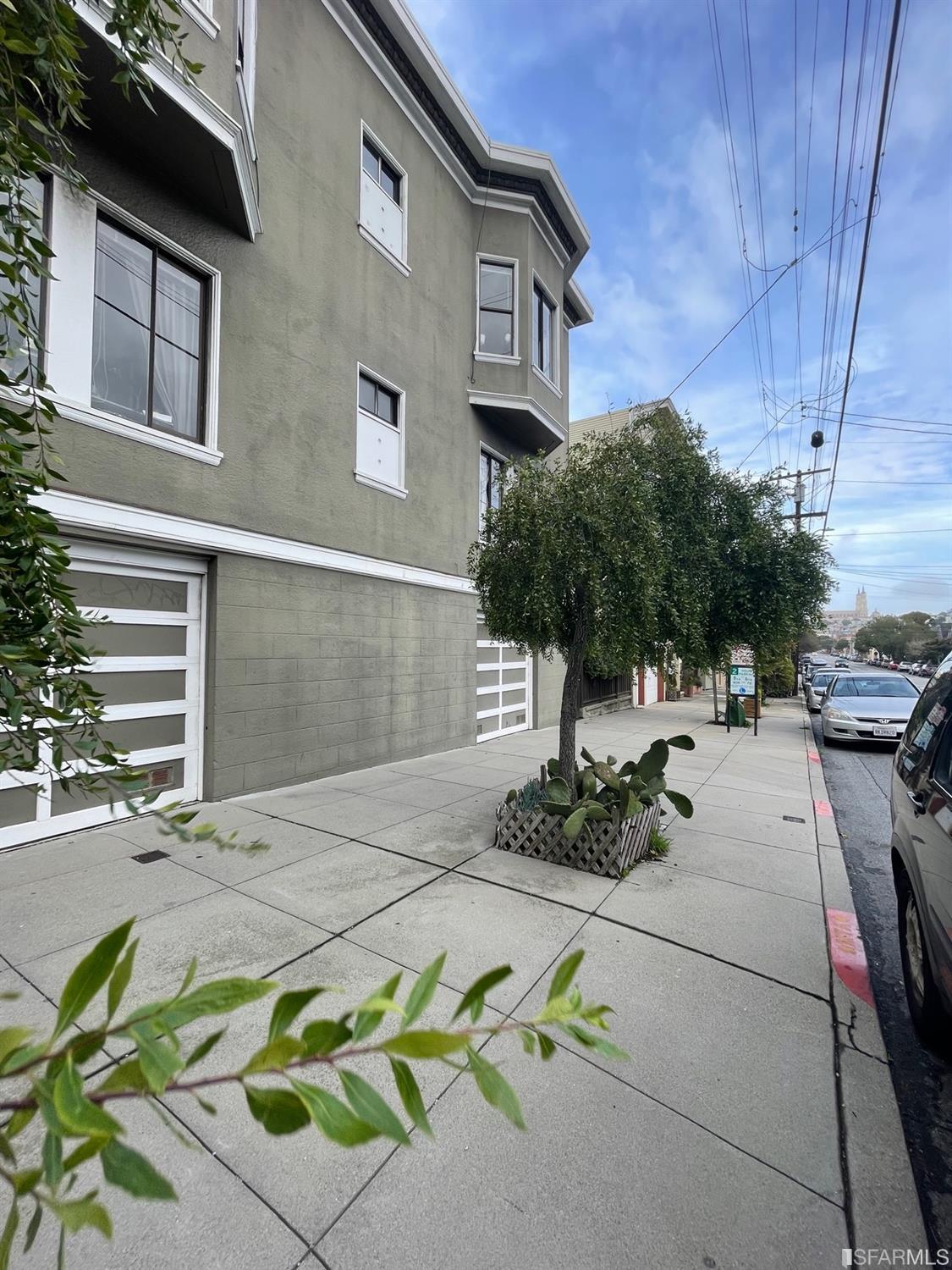 442-448 Cabrillo Street San Francisco, CA 94118 - Photo 4 of 4 a front view of a house with sitting area