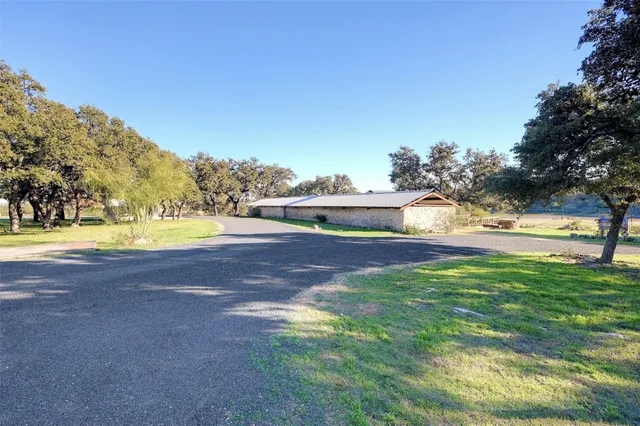 a view of a chairs and tables in the yard