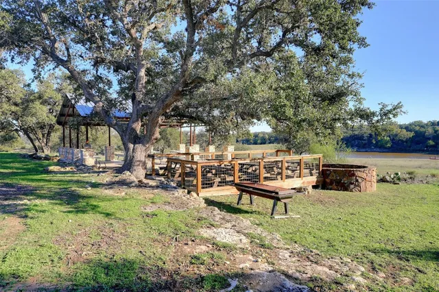a view of a backyard with sitting area