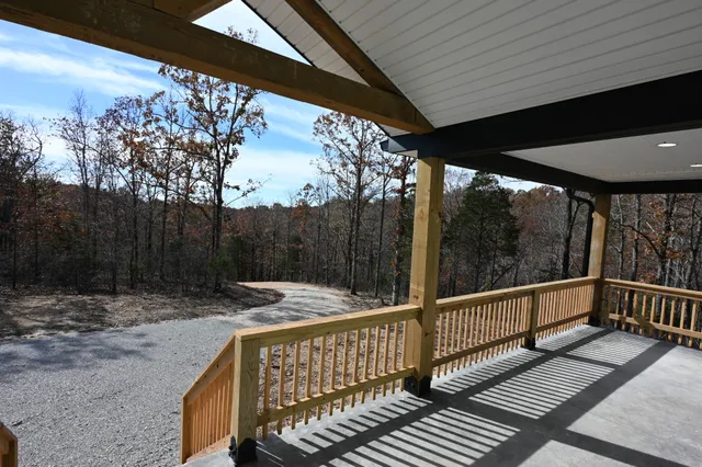 a view of a balcony with wooden floor