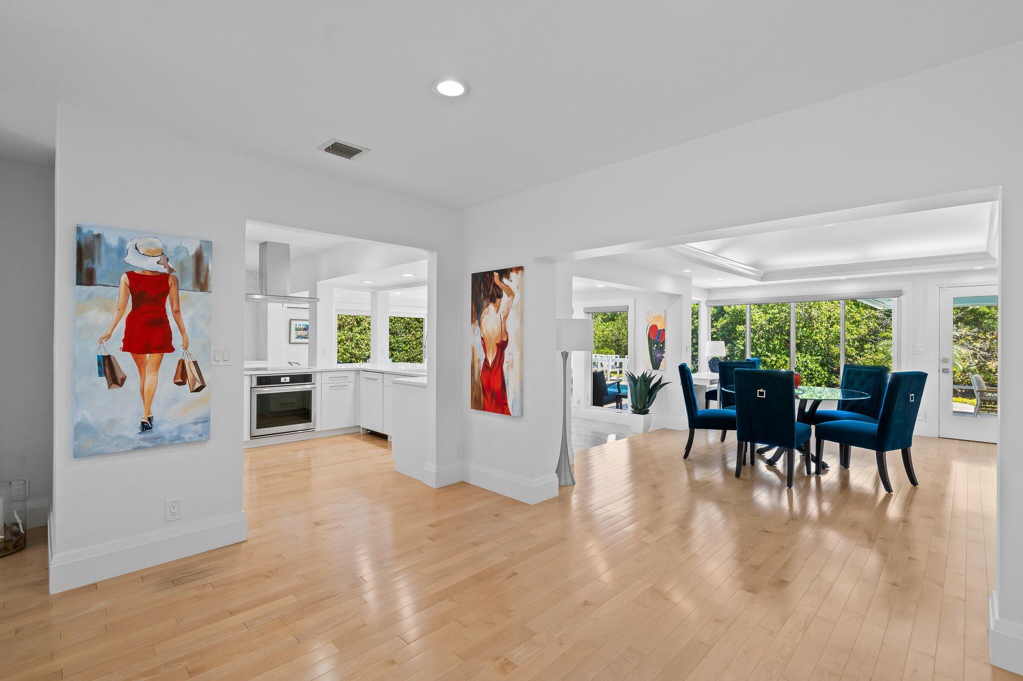 1090 Cypress Way Boca Raton, FL 33486 - Photo 12 of 40 a dining room with furniture and a floor to ceiling window