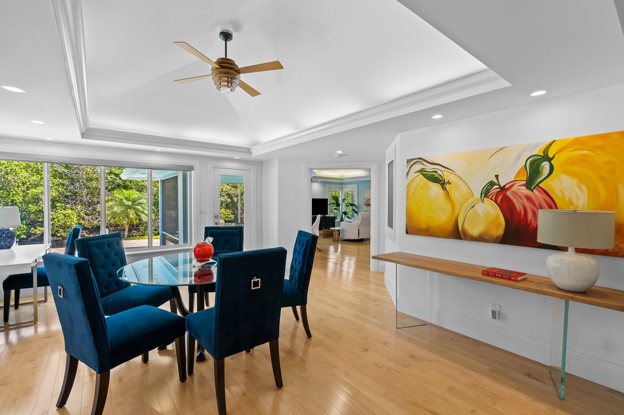 1090 Cypress Way Boca Raton, FL 33486 - Photo 14 of 40 a dining room with furniture a rug and a floor to ceiling window