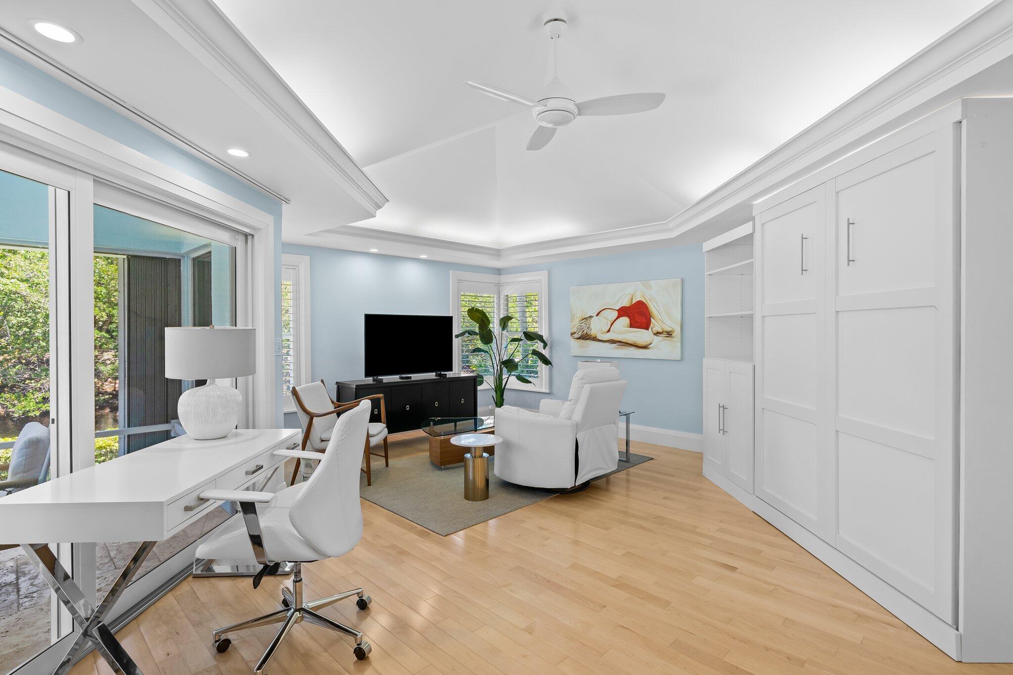 1090 Cypress Way Boca Raton, FL 33486 - Photo 18 of 40 a living room with furniture and a flat screen tv